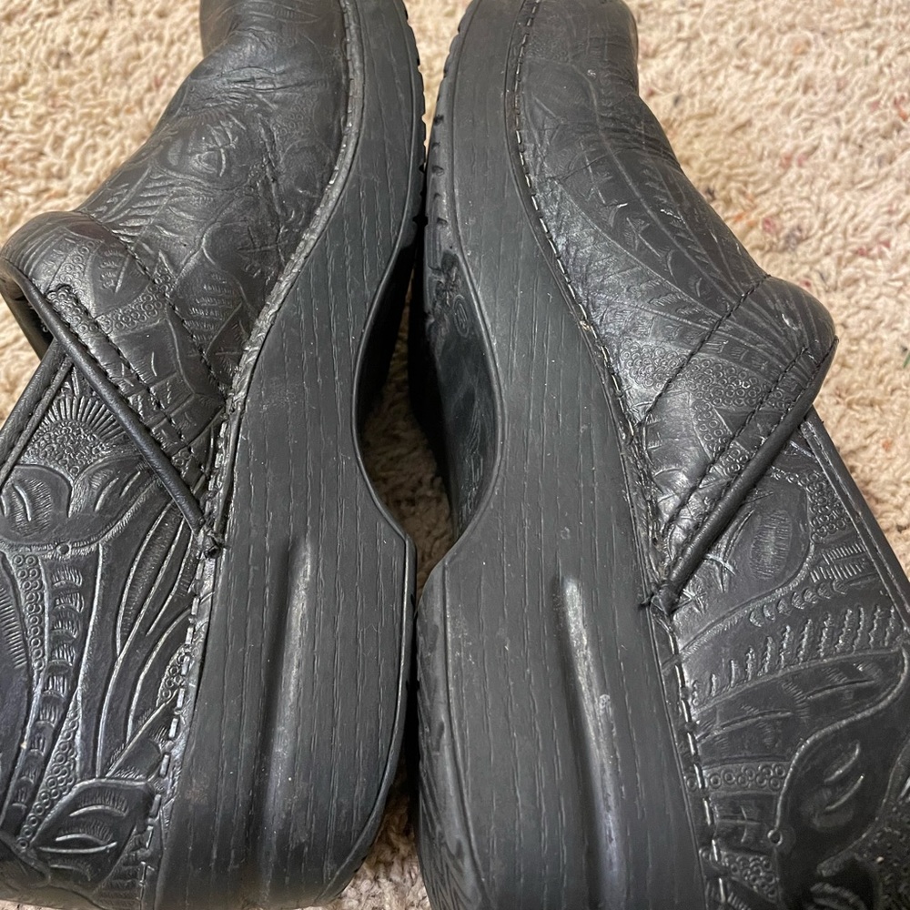 Size 40 Dansko hand tooled clogs. Black